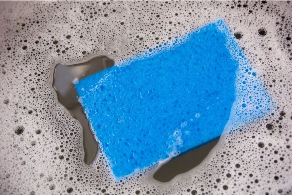 clean a silicone baking mat with warm, soapy water